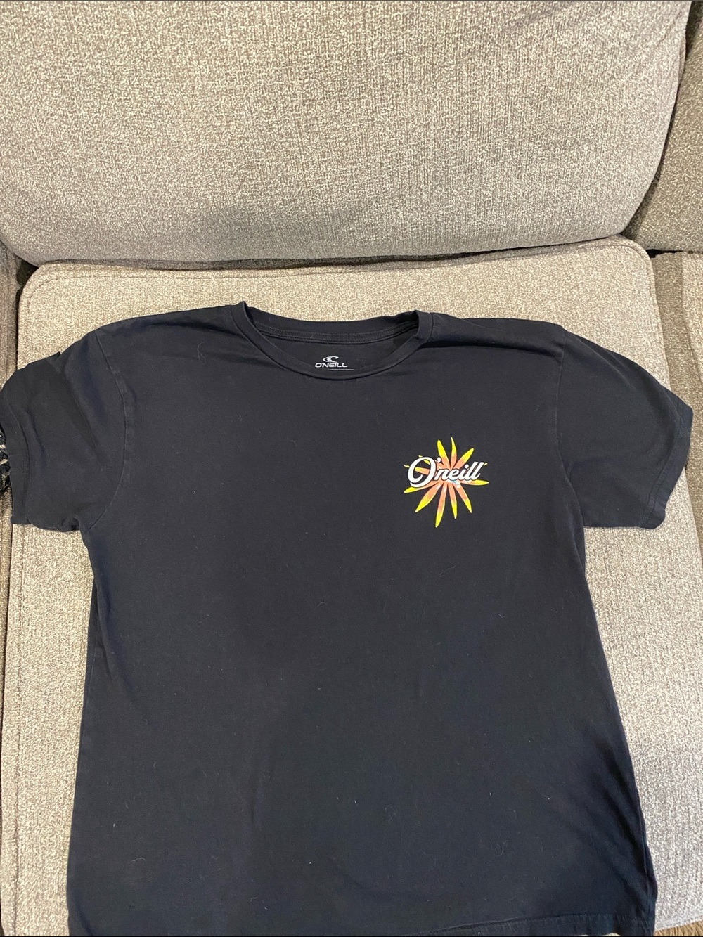 O'Neill Black Tee with Yellow and Orange Sunburst Logo